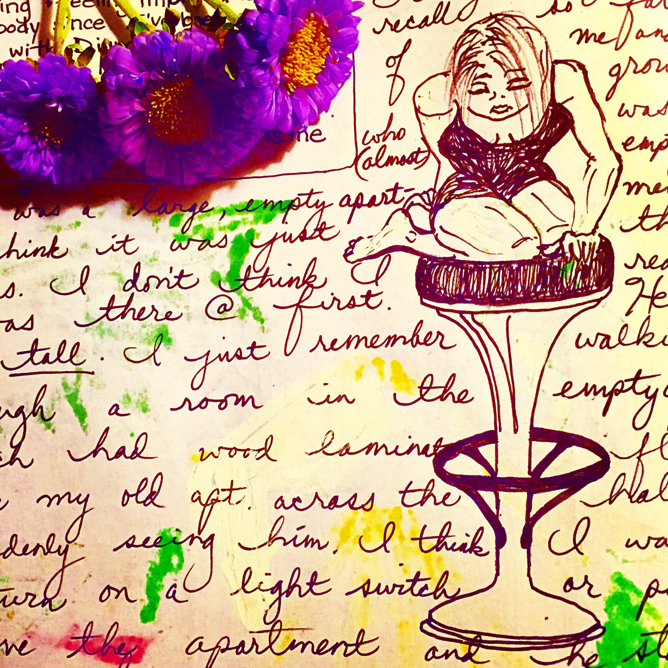 sad looking girl on a highbar stool with real purple flowers 